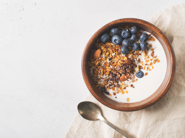 istock Homemade granola muesli with blueberries on white background breakfast 1125590874