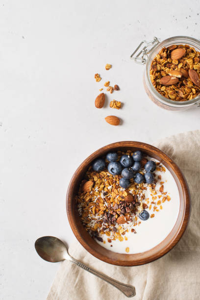 istock Homemade granola muesli with blueberries on white background breakfast 1125590891