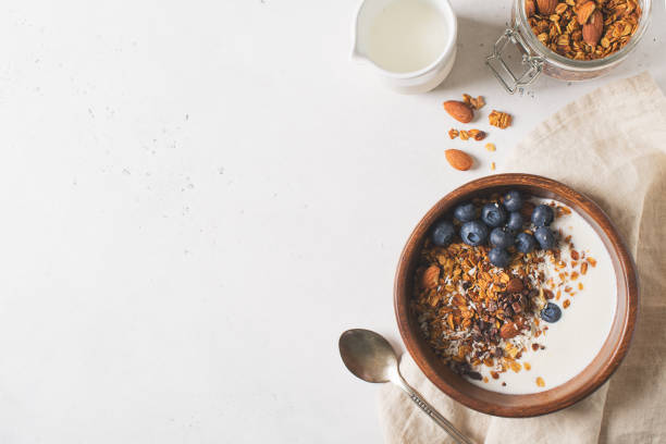 istock Homemade granola muesli with blueberries on white background breakfast 1125590909