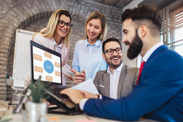 istock Business people working in office together. Team work in office. 1125591952