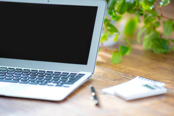 istock Wooden floor and laptop 1125593564