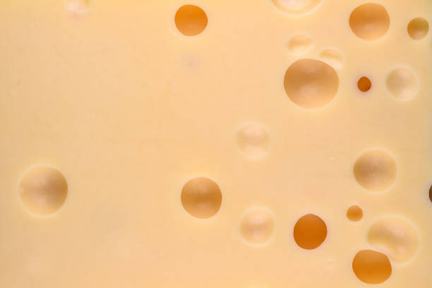 istock Cheese with big holes. Food background. 1125594150