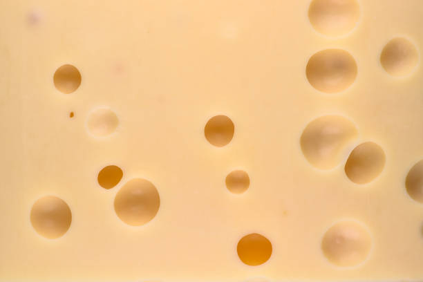 istock Cheese with big holes. Food background. 1125594219