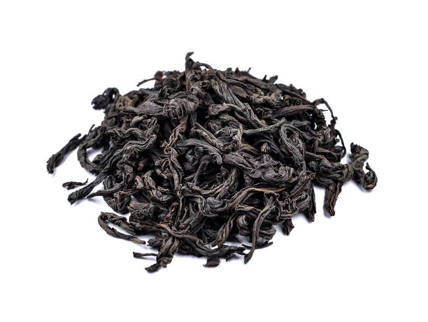 istock Dry tea leaves isolated on white background. Top view 1125594231