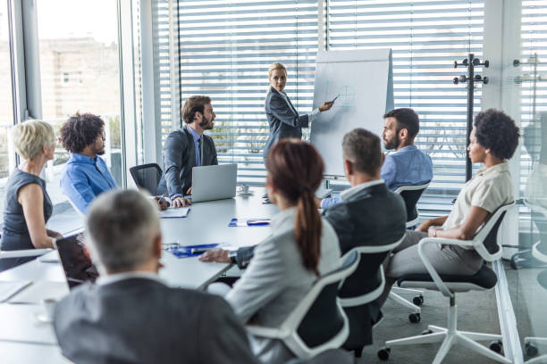 Female CEO leading a business presentation in the office.