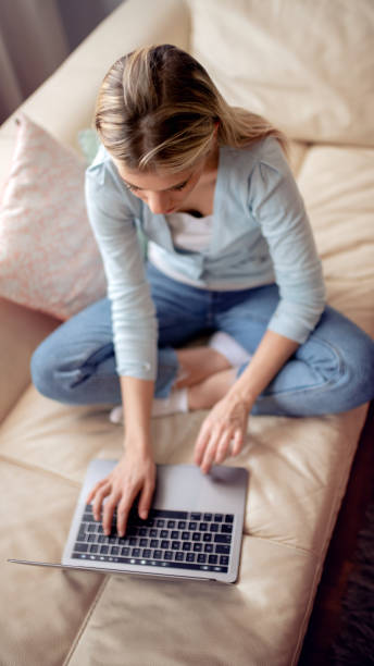 istock Happy woman working on a laptop from home 1125599636