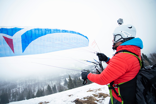 Paraglider over mountains