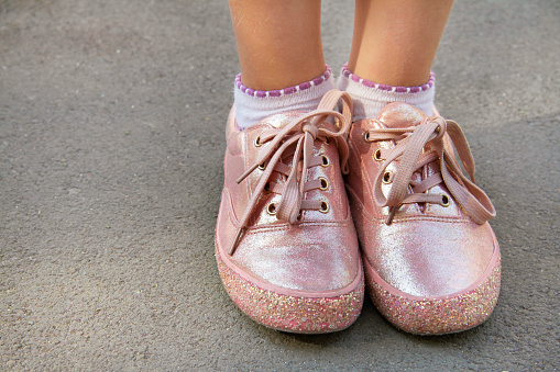 Childly legs in light pink color sneakers with glamor glitter and shoelaces