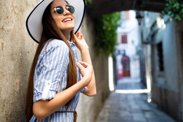 istock Smiling summer woman with hat and sunglasses on vacation 1125607772