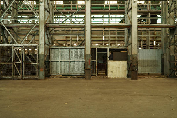 istock Interior view of generic rusty machinery factory 1125609459