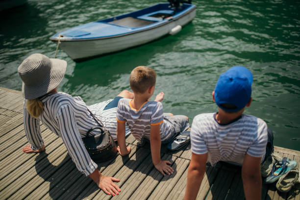 istock Mother and sons in marina 1125609549