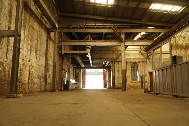 istock Interior view of generic rusty machinery factory 1125609559