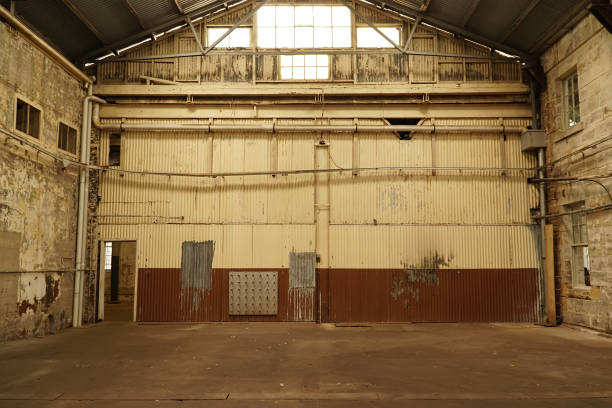 istock Interior view of generic rusty machinery factory 1125609560