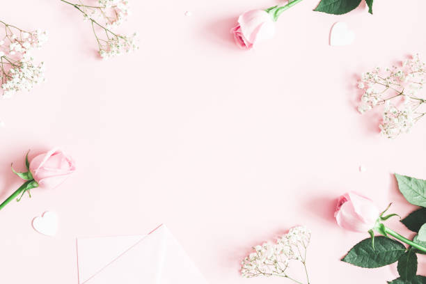 istock Valentine's Day composition. Pink rose flowers, envelope on pastel pink background. Valentines day, mothers day, womens day concept. Flat lay, top view, copy space 1125609804