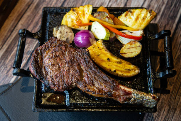 istock Grilled meat and vegetables. T-bone steak in a restaurant. 1125609978