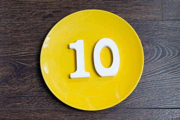 istock Number ten on a yellow plate. 1125611330