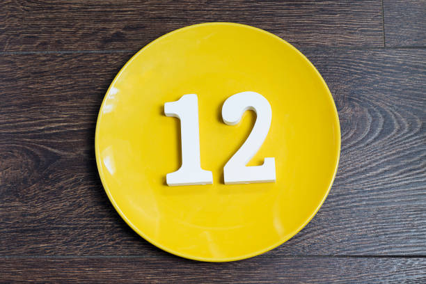 istock Number twelve on the yellow plate. 1125611356