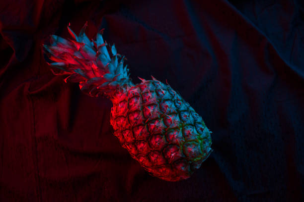 Pineapple in dark neon color on blackbackground