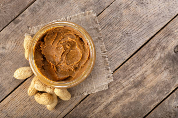 istock peanut butter in glass jar 1125613856