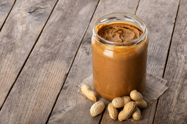 istock peanut butter in glass jar 1125613858