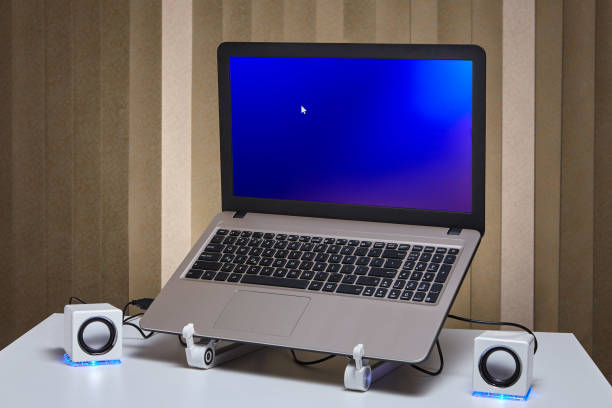 istock Starting laptop with two speakers on the sides. 1125614888
