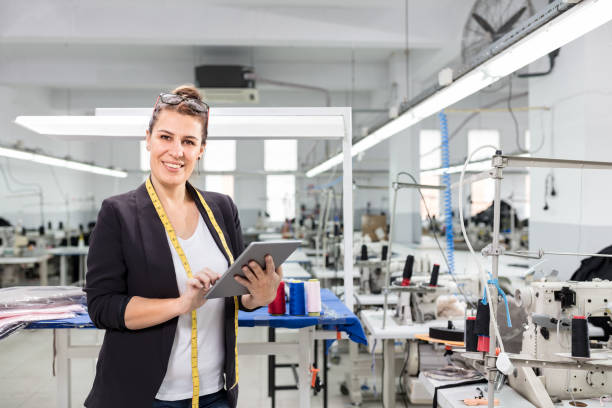 istock Woman designer posing with digital tablet. 1125618068