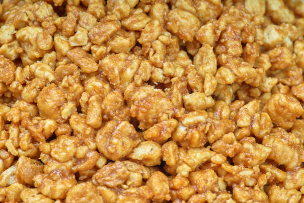 istock Sweet background and texture, nuts in caramel, close-up 1125618154