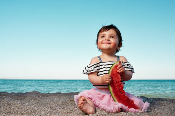istock enjoying slice of watermelon 1125621250