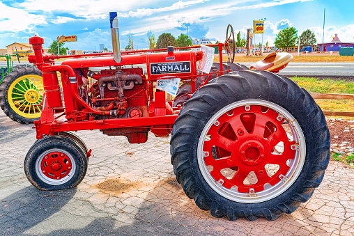 Valle, Arizona, USA - September 19, 2018: An old tractor stands in the fields of Arizona.