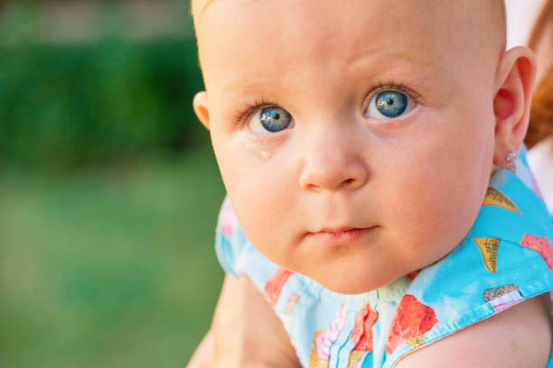 istock baby girl with teardrop 1125627206
