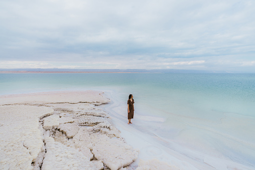 Young Caucasian woman resting near Dead Sea