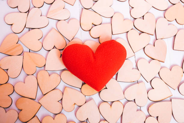 istock Wood hearts on white wooden background have frame copy space 1125630457