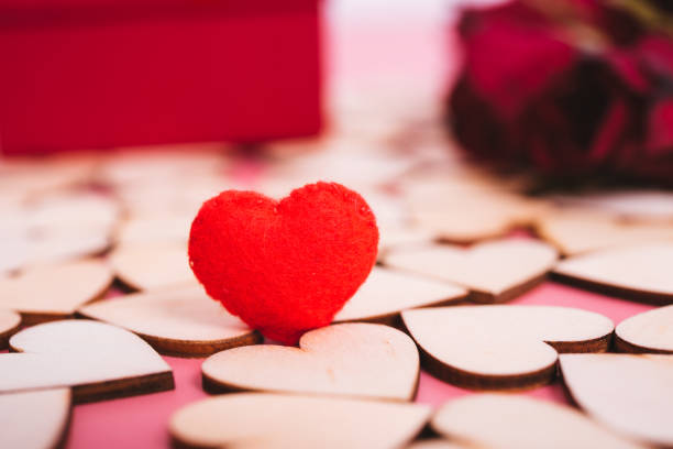 istock Wood hearts on pink background have copy space 1125630542
