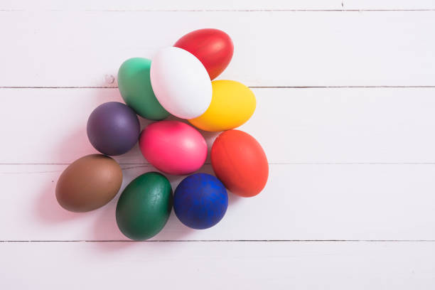 istock Colorful easter eggs clean on wooden background 1125630695
