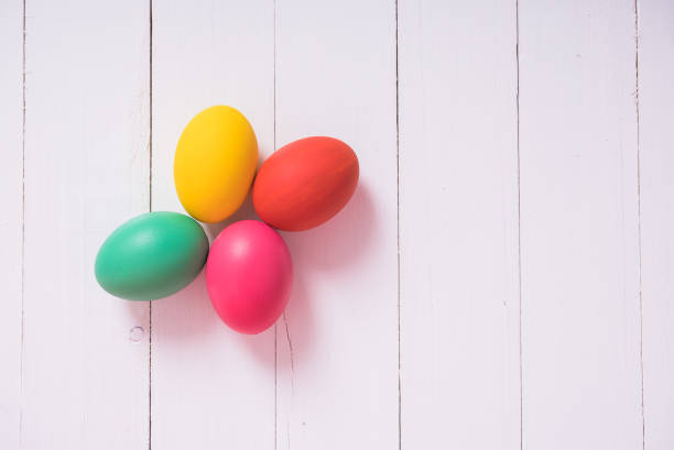 istock Colorful easter eggs clean on wooden background 1125630706