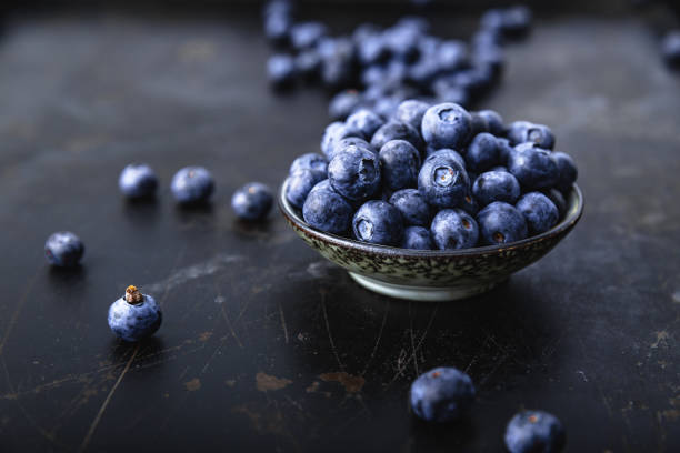 istock Juicy and fresh blueberries on a beautiful background in a bowl 1125630887