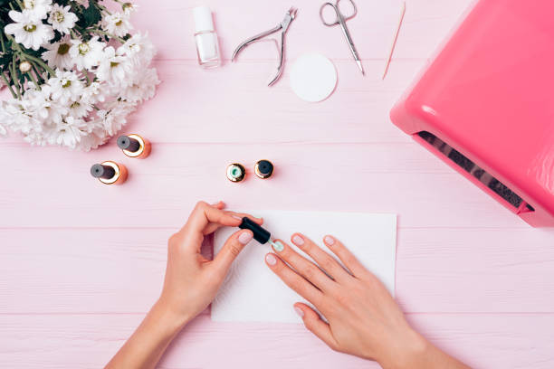 istock View from above woman painting her nails 1125631649