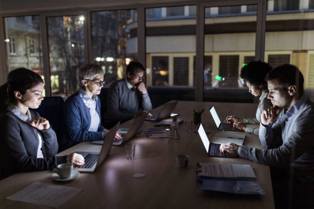 istock Business people working late on computers in the office. 1125631720