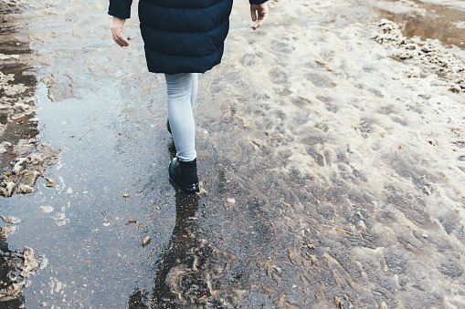 Close-up legs of young woman walking