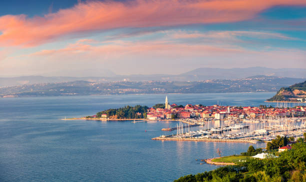 Aerial view of old fishing town Izola. Impressive spring sunset in Slovenia, Europe. Beautiful seascape Adriatic Sea. Traveling concept background. stock photo