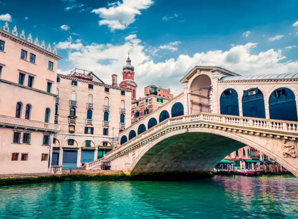 Splendid scene of famous Grand Canal. Colorful spring view of Rialto Bridge. Picturesque morning cityscape of  Venice, Italy, Europe. Traveling concept background.