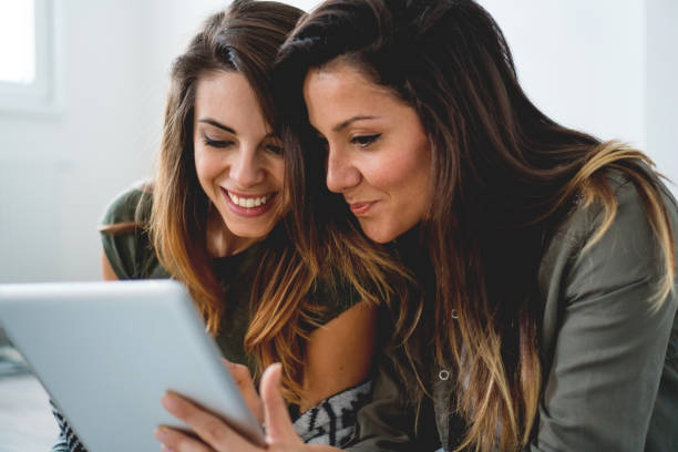 istock Smiling couple looking at digital tablet 1125634192