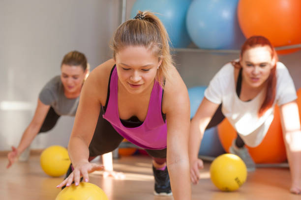 istock Young women training in fitness class 1125636091