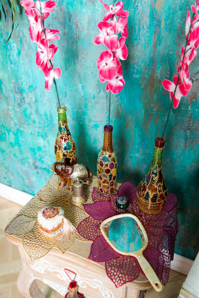 istock Bottles and flowers on the bedside table. 1125640430