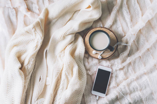 Cup of coffe with phone and headphones