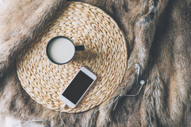 istock Cup of coffe with phone and headphones 1125640979