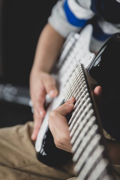 istock British Indian boy playing the guitar 1125643931