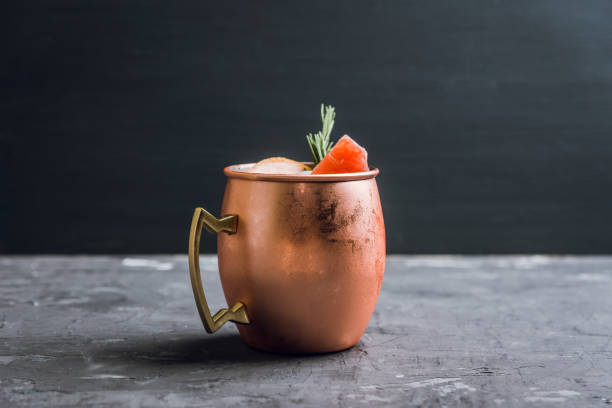 istock Grapefruit moscow mule in copper mug on the rustic background 1125644147