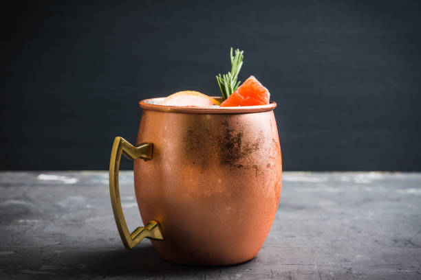 istock Grapefruit moscow mule in copper mug on the rustic background 1125644161
