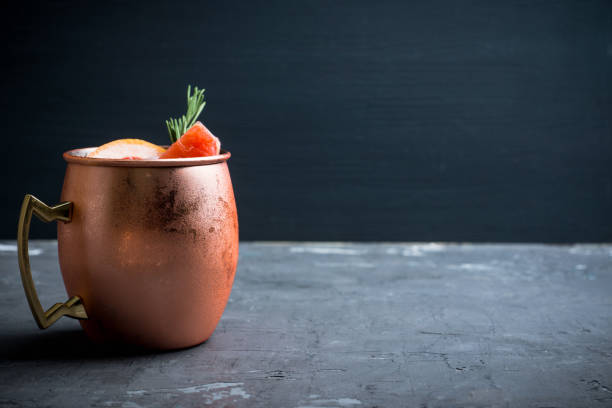 istock Grapefruit moscow mule in copper mug on the rustic background 1125644163